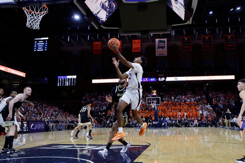 Feb 17, 2024; Charlottesville, Virginia, USA; Virginia Cavaliers guard Reece Beekman (2) shoots the ball as Wake Forest Demon Deacons forward Efton Reid III (4) defends in the second half at John Paul Jones Arena. Mandatory Credit: Geoff Burke-USA TODAY Sports