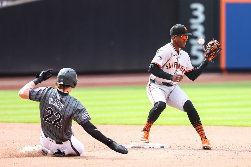 May 25, 2024; New York City, New York, USA;  New York Mets third baseman Brett Baty (22) slides safely into second base when the ball is thrown past San Francisco Giants shortstop Marco Luciano (37) in the ninth inning at Citi Field. Mandatory Credit: Wendell Cruz-USA TODAY Sports