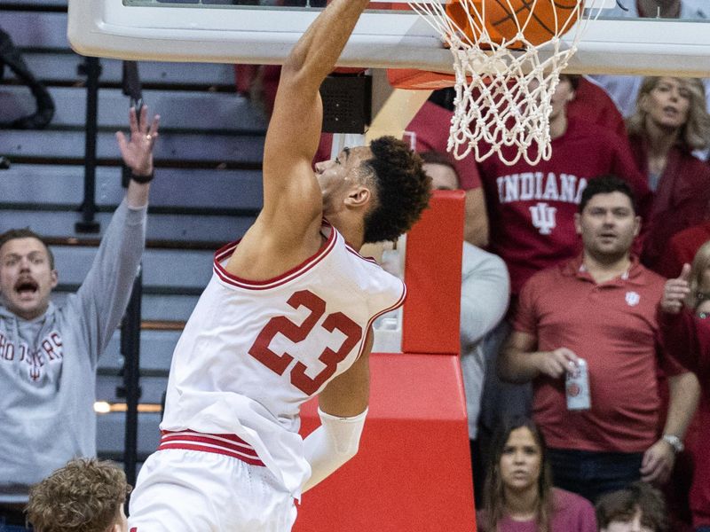 Jan 14, 2023; Bloomington, Indiana, USA; Indiana Hoosiers forward Trayce Jackson-Davis (23) shoots the ball while Wisconsin Badgers guard Max Klesmit (11) defends in the second half at Simon Skjodt Assembly Hall. Mandatory Credit: Trevor Ruszkowski-USA TODAY Sports