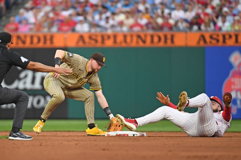 Jun 30, 2025; Philadelphia, Pennsylvania, USA; Philadelphia Phillies outfielder Brandon Marsh (16) steals second base ahead of tag by San Diego Padres second base Jake Cronenworth (9) during the fourth inning at Citizens Bank Park. Mandatory Credit: Eric Hartline-Imagn Images
