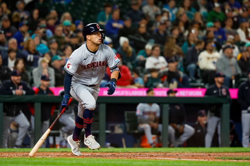 Apr 2, 2024; Seattle, Washington, USA; Cleveland Guardians center fielder Tyler Freeman (2) hits an RBI-sacrifice fly against the Seattle Mariners during the seventh inning at T-Mobile Park. Mandatory Credit: Joe Nicholson-USA TODAY Sports