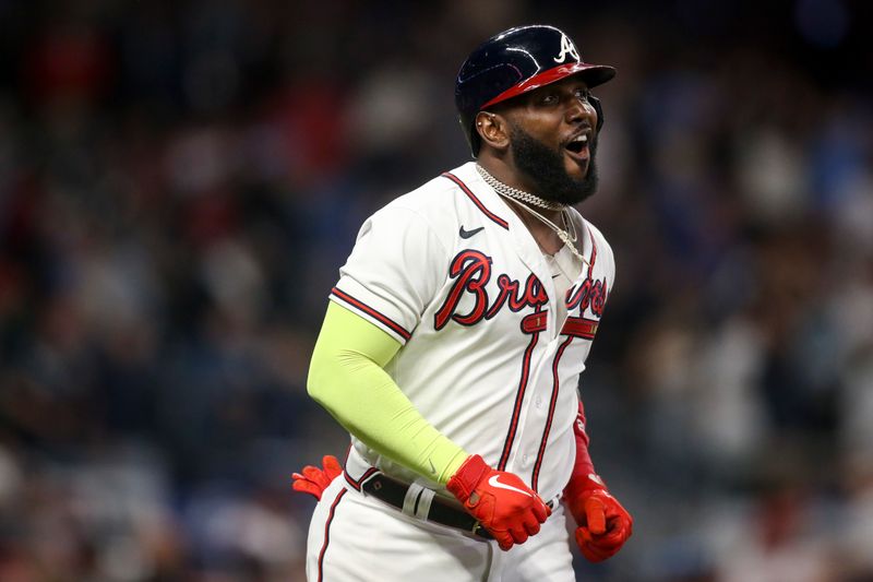 Oct 12, 2022; Atlanta, Georgia, USA; Atlanta Braves designated hitter Marcell Ozuna (20) reacts after hitting a fly ball for an out against the Philadelphia Phillies for the final out in the seventh inning during game two of the NLDS for the 2022 MLB Playoffs at Truist Park. Mandatory Credit: Brett Davis-USA TODAY Sports