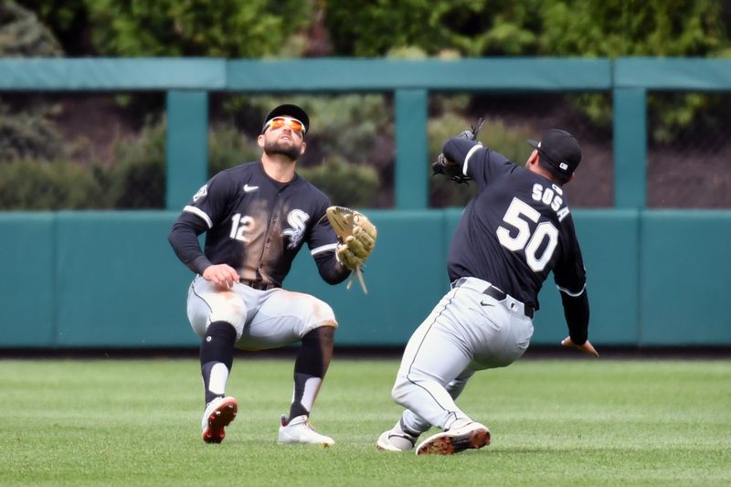 Apr 21, 2024; Philadelphia, Pennsylvania, USA; Chicago White Sox outfielder Kevin Pillar (12) prepares to catch fly ball as third base Lenyn Sosa (50) gets out to the way against the Philadelphia Phillies during the second inning at Citizens Bank Park. Mandatory Credit: Eric Hartline-USA TODAY Sports