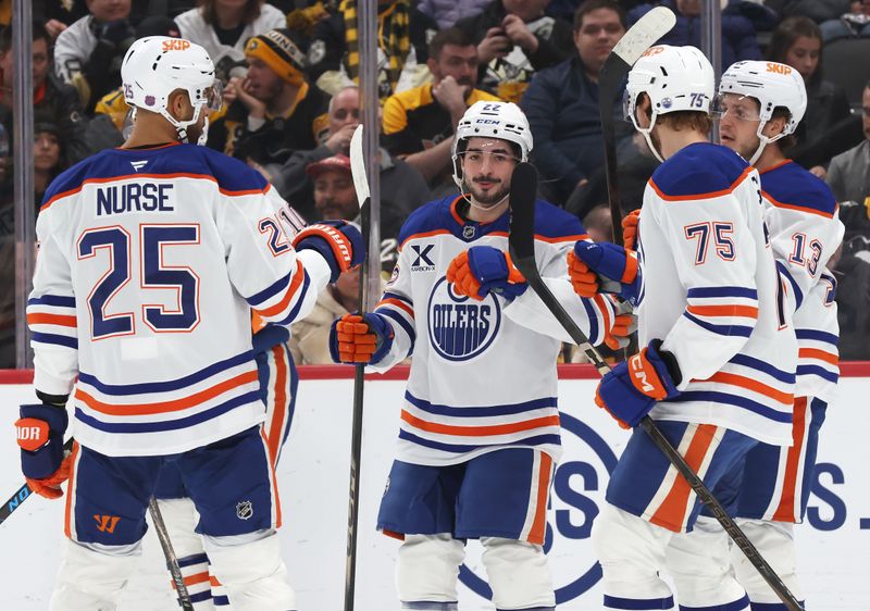 Dec 16, 2025; Pittsburgh, Pennsylvania, USA; The Edmonton Oilers celebrate a goal by center Matt Savoie (middle) against the Pittsburgh Penguins during the second period at PPG Paints Arena. Mandatory Credit: Charles LeClaire-Imagn Images