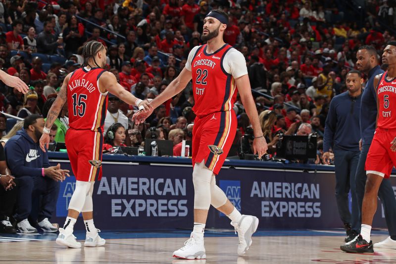 NEW ORLEANS, LA - APRIL 16: Jose Alvarado #15 of the New Orleans Pelicans high fives Larry Nance Jr. #22 during the game against the Los Angeles Lakers during the 2024 SoFi Play-In Tournament on April 16, 2024 at the Smoothie King Center in New Orleans, Louisiana. NOTE TO USER: User expressly acknowledges and agrees that, by downloading and or using this Photograph, user is consenting to the terms and conditions of the Getty Images License Agreement. Mandatory Copyright Notice: Copyright 2024 NBAE (Photo by Layne Murdoch Jr./NBAE via Getty Images)