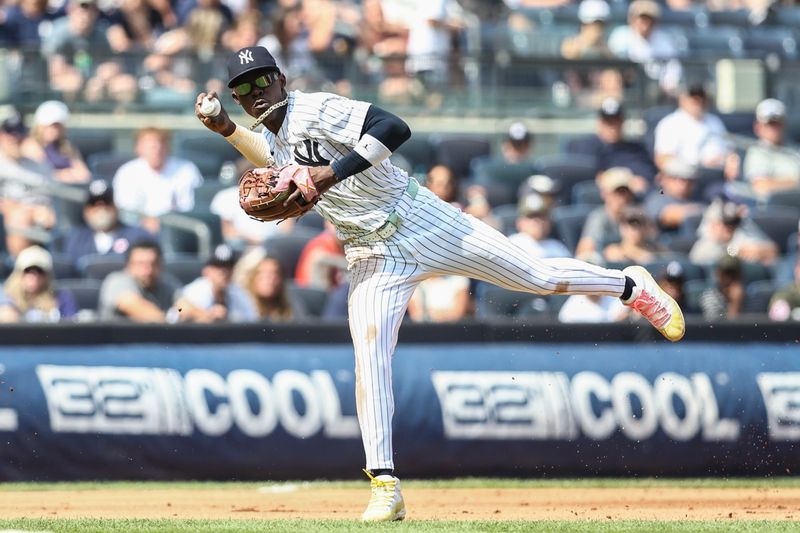 Aug 25, 2024; Bronx, New York, USA;  New York Yankees third baseman Jazz Chisholm Jr. (13) makes an off balanced throw to first base in the fifth inning against the Colorado Rockies at Yankee Stadium. Mandatory Credit: Wendell Cruz-USA TODAY Sports