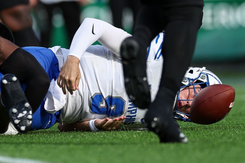 Oct 12, 2024; Orlando, Florida, USA; Memphis Tigers quarterback Seth Henigan (9) fumbles the ball against the South Florida Bulls in the second quarter at Camping World Stadium. Mandatory Credit: Nathan Ray Seebeck-Imagn Images