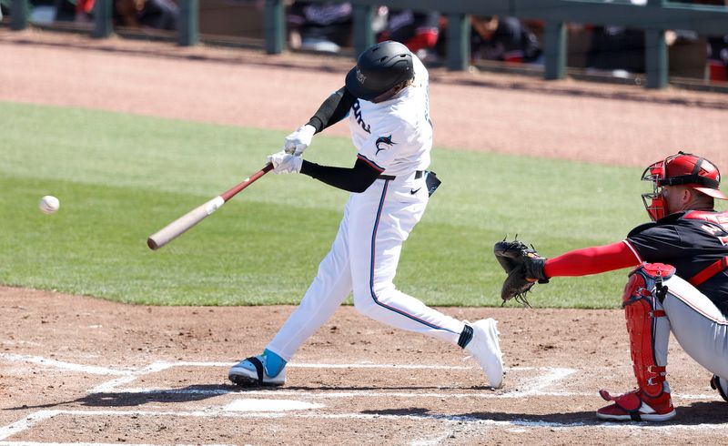 Feb 25, 2024; Jupiter, Florida, USA; Miami Marlins center fielder Nick Gordon (1) singles in a run against the Washington Nationals during the third inning at Roger Dean Chevrolet Stadium. Mandatory Credit: Rhona Wise-USA TODAY Sports