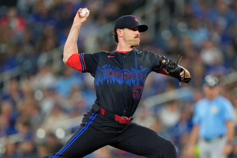 Sep 26, 2025; Toronto, Ontario, CAN; Toronto Blue Jays starting pitcher Shane Bieber (57) pitches to the Tampa Bay Rays during the first inning at Rogers Centre. Mandatory Credit: John E. Sokolowski-Imagn Images