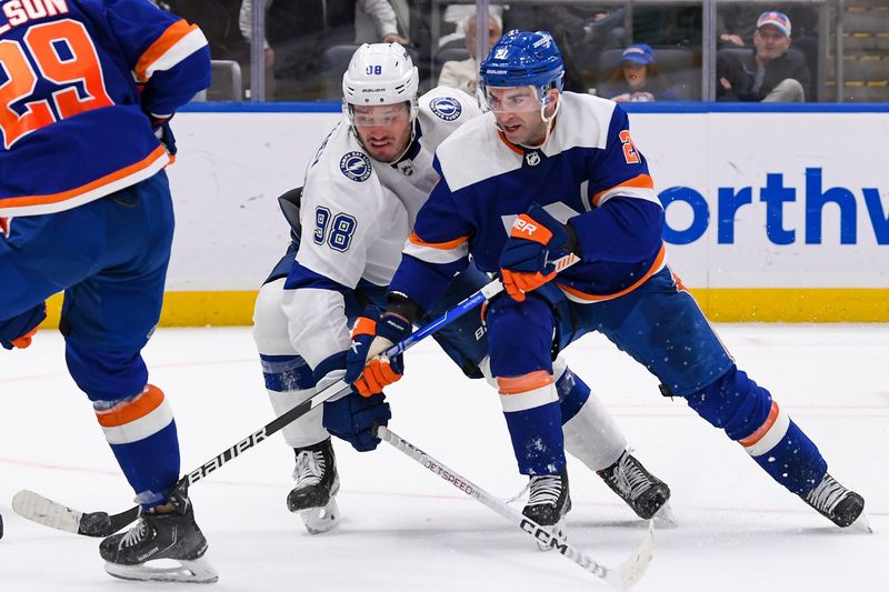 Apr 6, 2023; Elmont, New York, USA; Tampa Bay Lightning defenseman Mikhail Sergachev (98) defends against Tampa Bay Lightning center Brayden Point (21) during the second period at UBS Arena. Mandatory Credit: Dennis Schneidler-USA TODAY Sports