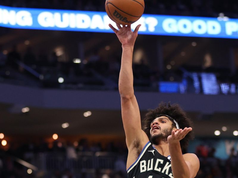 MILWAUKEE, WISCONSIN - NOVEMBER 18: Andre Jackson Jr. #44 of the Milwaukee Bucks shoots over Luka Doncic #77 of the Dallas Mavericks during the first half of a game at Fiserv Forum on November 18, 2023 in Milwaukee, Wisconsin. NOTE TO USER: User expressly acknowledges and agrees that, by downloading and or using this photograph, User is consenting to the terms and conditions of the Getty Images License Agreement. (Photo by Stacy Revere/Getty Images)