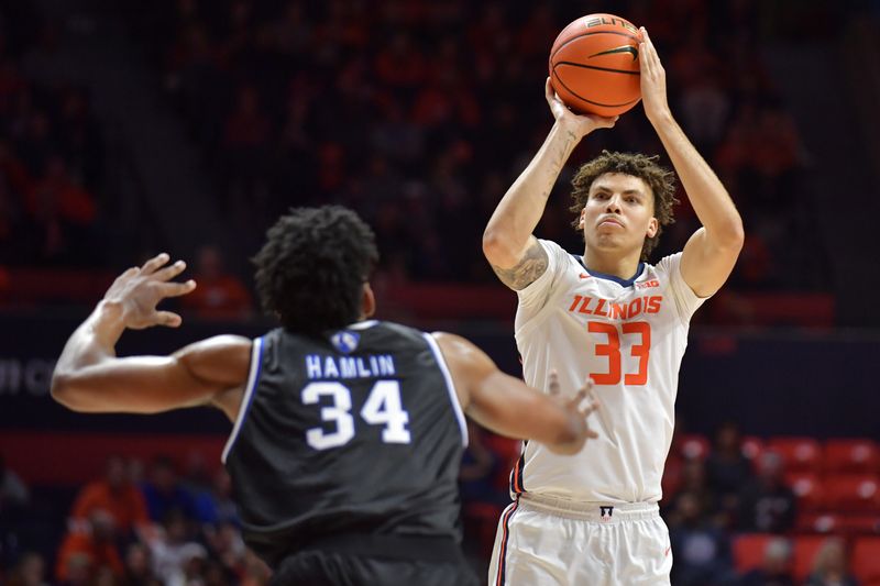 Nov 6, 2023; Champaign, Illinois, USA; Illinois Fighting Illini forward Coleman Hawkins (33) shoots as Eastern Illinois Panthers forward Jermaine Hamlin (34) defends during the first half at State Farm Center. Mandatory Credit: Ron Johnson-USA TODAY Sports