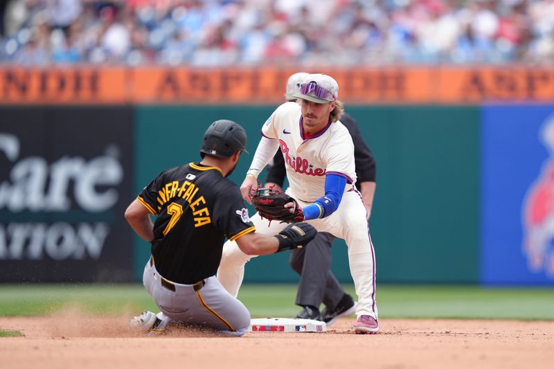 May 18, 2025; Philadelphia, Pennsylvania, USA; Philadelphia Phillies infielder Bryson Stott (5) catches Pittsburgh Pirates infielder Isiah Kiner-Falefa (7) stealing in the fifth inning at Citizens Bank Park. Mandatory Credit: Kyle Ross-Imagn Images