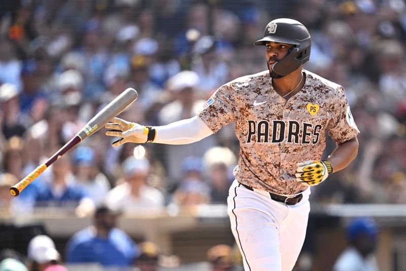 Apr 21, 2024; San Diego, California, USA; San Diego Padres second baseman Xander Bogaerts (2) tosses his bat after a bases-loaded walk against the Toronto Blue Jays during the eighth inning at Petco Park. Mandatory Credit: Orlando Ramirez-USA TODAY Sports