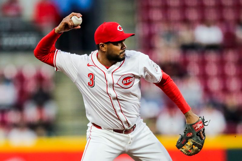 Apr 22, 2024; Cincinnati, Ohio, USA; Cincinnati Reds third baseman Jeimer Candelario (3) throws to first to get Philadelphia Phillies catcher J.T. Realmuto (not pictured) out in the eighth inning at Great American Ball Park. Mandatory Credit: Katie Stratman-USA TODAY Sports