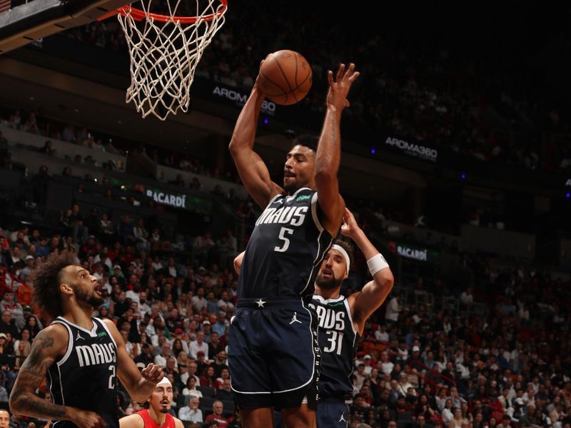 MIAMI, FL - NOVEMBER 24: Quentin Grimes #5 of the Dallas Mavericks goes up for the rebound during the game against the Miami Heat on November 24, 2024 at Kaseya Center in Miami, Florida. NOTE TO USER: User expressly acknowledges and agrees that, by downloading and or using this Photograph, user is consenting to the terms and conditions of the Getty Images License Agreement. Mandatory Copyright Notice: Copyright 2024 NBAE (Photo by Issac Baldizon/NBAE via Getty Images)