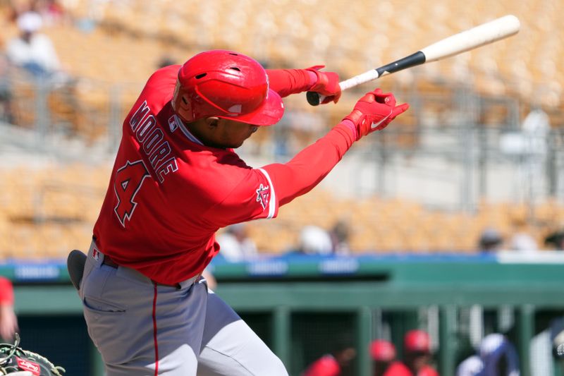 Mar 11, 2026; Phoenix, Arizona, USA; Los Angeles Angels second baseman Christian Moore (4) bats against the Chicago White Sox during the third inning at Camelback Ranch-Glendale. Mandatory Credit: Joe Camporeale-Imagn Images