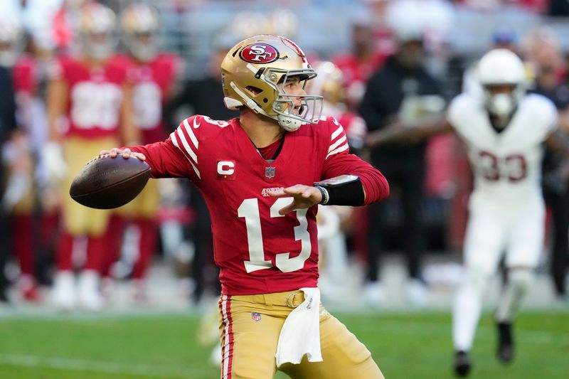 San Francisco 49ers quarterback Brock Purdy passes against the Arizona Cardinals during the second half of an NFL football game Sunday, Dec. 17, 2023, in Glendale, Ariz. (AP Photo/Ross D. Franklin)