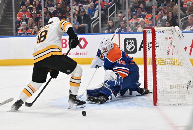 Dec 31, 2025; Edmonton, Alberta, CAN; Edmonton Oilers goalie Connor Ingram (39) blocks a shot from Boston Bruins center Pavel Zacha (18) in the second period at Rogers Place. Mandatory Credit: Walter Tychnowicz-Imagn Images