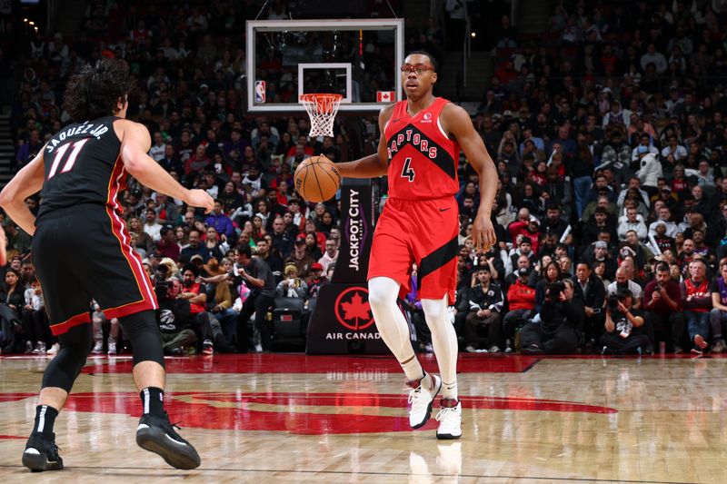 TORONTO, CANADA - DECEMBER 01:  Scottie Barnes #4 of the Toronto Raptors dribbles the ball during the game against the Miami Heat on December 1, 2024 at the Scotiabank Arena in Toronto, Ontario, Canada.  NOTE TO USER: User expressly acknowledges and agrees that, by downloading and or using this Photograph, user is consenting to the terms and conditions of the Getty Images License Agreement.  Mandatory Copyright Notice: Copyright 2024 NBAE (Photo by Vaughn Ridley/NBAE via Getty Images)