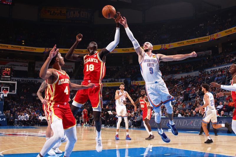 OKLAHOMA CITY, OK - OCTOBER 17: Mouhamed Gueye #18 of the Atlanta Hawks drives to the basket during the game against the Oklahoma City Thunder on October 17, 2024 at Paycom Arena in Oklahoma City, Oklahoma. NOTE TO USER: User expressly acknowledges and agrees that, by downloading and or using this photograph, User is consenting to the terms and conditions of the Getty Images License Agreement. Mandatory Copyright Notice: Copyright 2024 NBAE (Photo by Zach Beeker/NBAE via Getty Images)