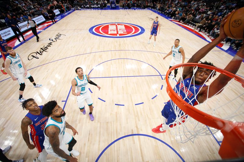 DETROIT, MI - March 11: James Wiseman #13 of the Detroit Pistons drives to the basket during the game against the Charlotte Hornets on March 11, 2024 at Little Caesars Arena in Detroit, Michigan. NOTE TO USER: User expressly acknowledges and agrees that, by downloading and/or using this photograph, User is consenting to the terms and conditions of the Getty Images License Agreement. Mandatory Copyright Notice: Copyright 2024 NBAE (Photo by Brian Sevald/NBAE via Getty Images)