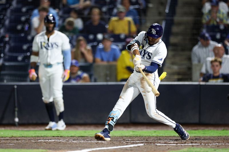 Sep 17, 2025; Tampa, Florida, USA; Tampa Bay Rays center fielder Chandler Simpson (14) hits an rbi single against the Toronto Blue Jays in the seventh inning at George M. Steinbrenner Field. Mandatory Credit: Nathan Ray Seebeck-Imagn Images