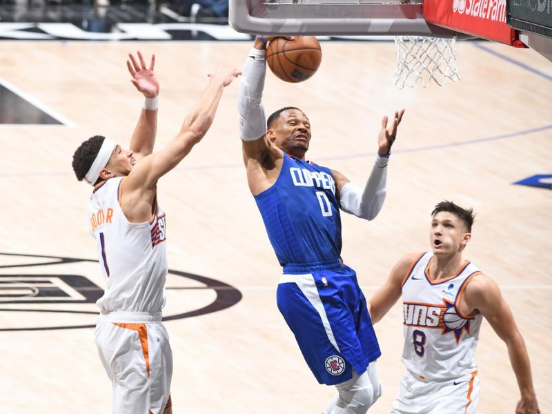 LOS ANGELES, CA - JANUARY 8: Russell Westbrook #0 of the LA Clippers rebounds the ball during the game against the Phoenix Suns on January 8, 2024 at Crypto.Com Arena in Los Angeles, California. NOTE TO USER: User expressly acknowledges and agrees that, by downloading and/or using this Photograph, user is consenting to the terms and conditions of the Getty Images License Agreement. Mandatory Copyright Notice: Copyright 2024 NBAE (Photo by Andrew D. Bernstein/NBAE via Getty Images)