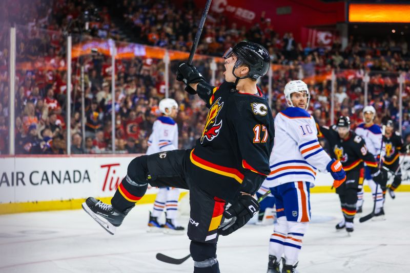 Apr 6, 2024; Calgary, Alberta, CAN; Calgary Flames center Yegor Sharangovich (17) celebrates his goal against the Edmonton Oilers during the second period at Scotiabank Saddledome. Mandatory Credit: Sergei Belski-USA TODAY Sports