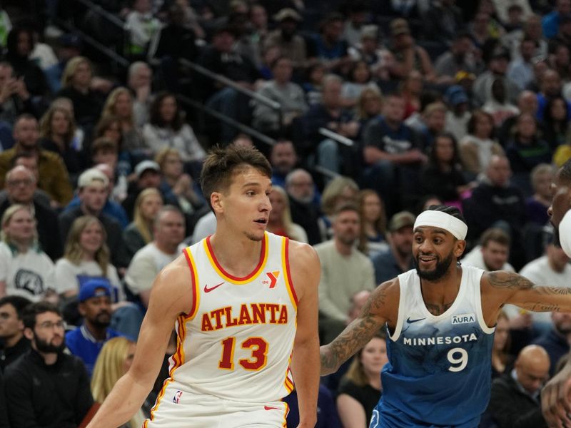 MINNEAPOLIS, MN -  APRIL 12: Bogdan Bogdanovic #13 of the Atlanta Hawks handles the ball during the game against the Minnesota Timberwolves on April 12, 2024 at Target Center in Minneapolis, Minnesota. NOTE TO USER: User expressly acknowledges and agrees that, by downloading and or using this Photograph, user is consenting to the terms and conditions of the Getty Images License Agreement. Mandatory Copyright Notice: Copyright 2024 NBAE (Photo by Jordan Johnson/NBAE via Getty Images)