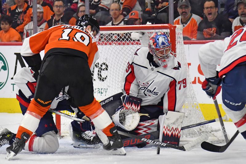 Apr 16, 2024; Philadelphia, Pennsylvania, USA; Washington Capitals goaltender Charlie Lindgren (79) battles for the puck with Philadelphia Flyers right wing Garnet Hathaway (19) during the second period at Wells Fargo Center. Mandatory Credit: Eric Hartline-USA TODAY Sports