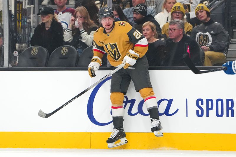 Dec 27, 2025; Las Vegas, Nevada, USA; Vegas Golden Knights right wing Alexander Holtz (26) avoids a Colorado Avalanche dump in during the first period at T-Mobile Arena. Mandatory Credit: Stephen R. Sylvanie-Imagn Images