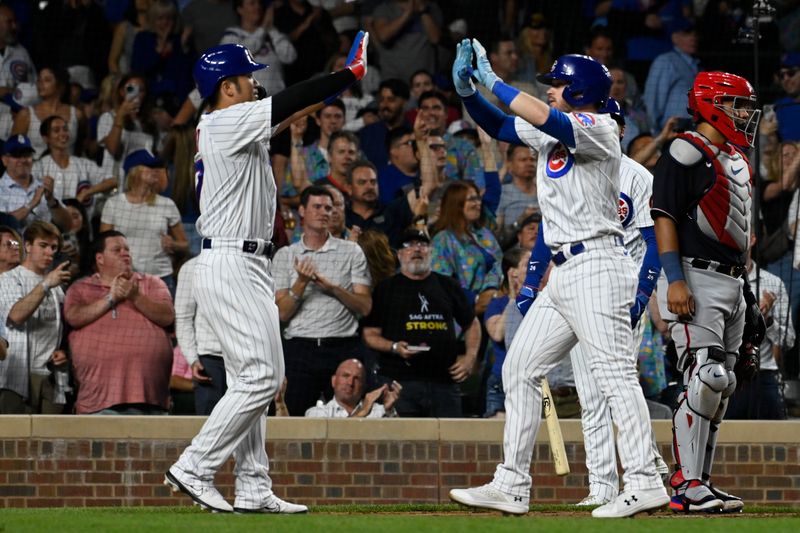 Jul 17, 2023; Chicago, Illinois, USA;  Chicago Cubs left fielder Ian Happ (8) high fives Chicago Cubs right fielder Seiya Suzuki (27) after they score on Happ   s two-run home run against the Washington Nationals during the sixth inning at Wrigley Field. Mandatory Credit: Matt Marton-USA TODAY Sports