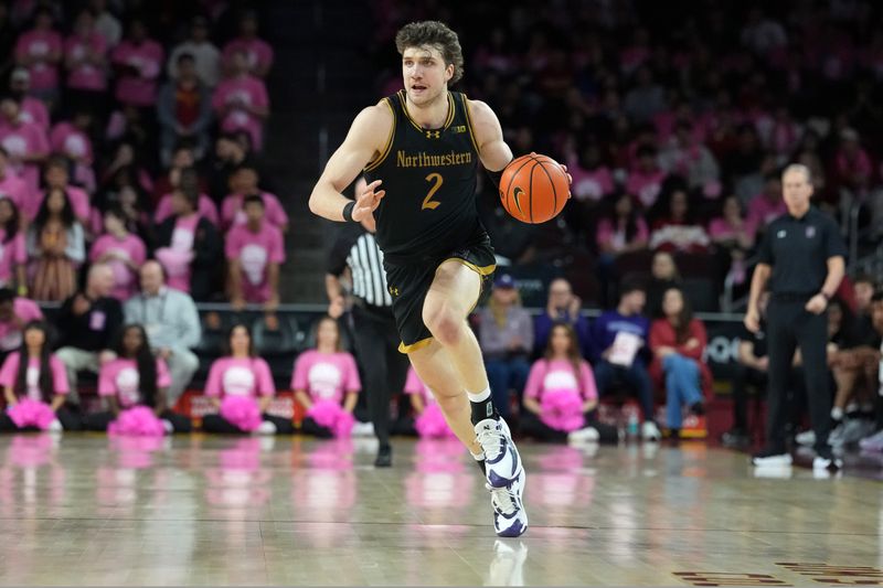 Jan 21, 2026; Los Angeles, California, USA; Northwestern Wildcats forward Nick Martinelli (2) dribbles the ball against the Southern California Trojans in the first half at Galen Center. Mandatory Credit: Kirby Lee-Imagn Images