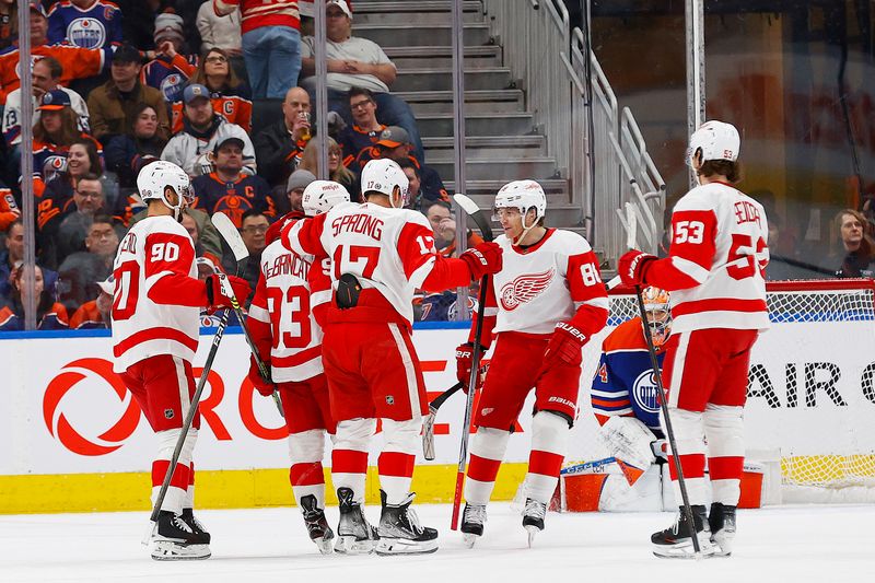 Feb 13, 2024; Edmonton, Alberta, CAN; The Detroit Red Wings celebrate a goal scored by forward Alex DeBeincat (93) during the first period against the Edmonton Oilers at Rogers Place. Mandatory Credit: Perry Nelson-USA TODAY Sports