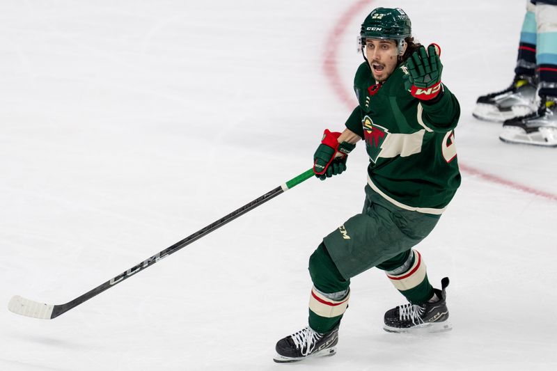 Apr 18, 2024; Saint Paul, Minnesota, USA; Minnesota Wild center Marat Khusnutdinov (22) reacts to penalty in the second period against the Seattle Kraken at Xcel Energy Center. Mandatory Credit: Matt Blewett-USA TODAY Sports