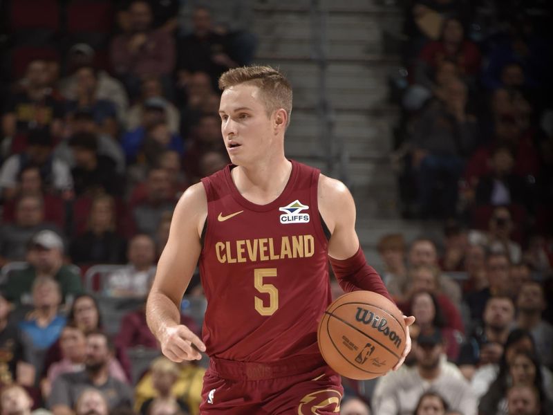 CLEVELAND, OH - NOVEMBER 4: Sam Merrill #5 of the Cleveland Cavaliers dribbles the ball during the game against the Milwaukee Bucks on November 4, 2024 at Rocket Mortgage FieldHouse in Cleveland, Ohio. NOTE TO USER: User expressly acknowledges and agrees that, by downloading and/or using this Photograph, user is consenting to the terms and conditions of the Getty Images License Agreement. Mandatory Copyright Notice: Copyright 2024 NBAE (Photo by David Liam Kyle/NBAE via Getty Images)