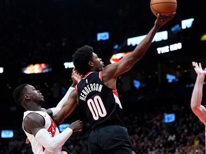 TORONTO, ON - OCTOBER 30: Scoot Henderson #00 of the Portland Trail Blazers goes to the basket against Dennis Schroder #17 of the Toronto Raptors during the first half of their basketball game at the Scotiabank Arena on October 30, 2023 in Toronto, Ontario, Canada. NOTE TO USER: User expressly acknowledges and agrees that, by downloading and/or using this Photograph, user is consenting to the terms and conditions of the Getty Images License Agreement. (Photo by Mark Blinch/Getty Images)