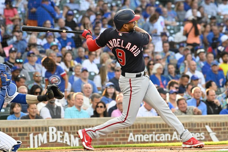 Jul 17, 2023; Chicago, Illinois, USA;  Washington Nationals third baseman Jeimer Candelario (9) hits a two-run home run against the Chicago Cubs during the first inning at Wrigley Field. Mandatory Credit: Matt Marton-USA TODAY Sports