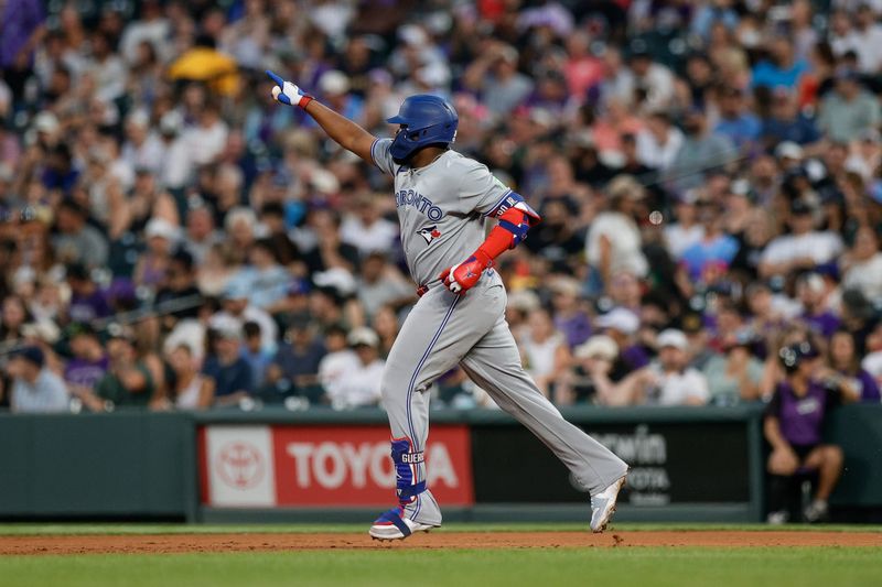 Aug 5, 2025; Denver, Colorado, USA; Toronto Blue Jays first baseman Vladimir Guerrero Jr. (27) rounds the bases on a solo home run in the sixth inning against the Colorado Rockies at Coors Field. Mandatory Credit: Isaiah J. Downing-Imagn Images