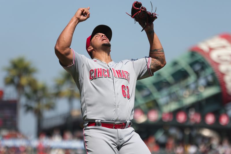 Aug 30, 2023; San Francisco, California, USA; Cincinnati Reds relief pitcher Fernando Cruz (63) celebrates after the play during the eighth inning against the San Francisco Giants at Oracle Park. Mandatory Credit: Sergio Estrada-USA TODAY Sports