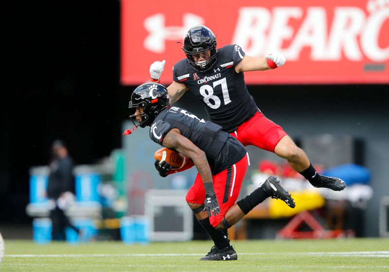 Oct 3, 2020; Cincinnati, OH, USA; Cincinnati Bearcats wide receiver Jordan Jones (5) catchers next to tight end Bruno Labelle (87)during the second quarter against the South Florida Bulls at Nippert Stadium. Mandatory Credit: Joseph Maiorana-USA TODAY Sports