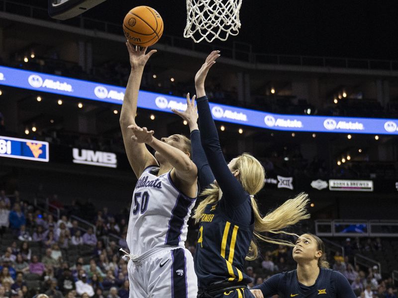 Mar 9, 2024; Kansas City, MO, USA; Kansas State Wildcats center Ayoka Lee (50) shoots the ball while defended by West Virginia Mountaineers forward Kylee Blacksten (14) during the second half at T-Mobile Center. Mandatory Credit: Amy Kontras-USA TODAY Sports