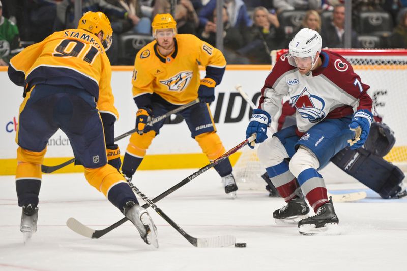 Dec 9, 2025; Nashville, Tennessee, USA;  Colorado Avalanche defenseman Devon Toews (7) battles Nashville Predators center Steven Stamkos (91) for the puck during the second period at Bridgestone Arena. Mandatory Credit: Steve Roberts-Imagn Images