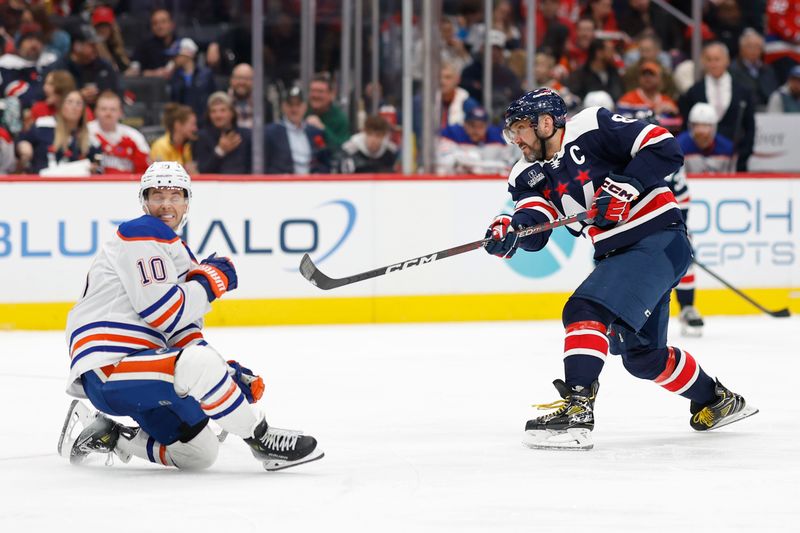 Nov 24, 2023; Washington, District of Columbia, USA; Washington Capitals left wing Alex Ovechkin (8) shoots the puck as Edmonton Oilers center Derek Ryan (10) defends in the third period at Capital One Arena. Mandatory Credit: Geoff Burke-USA TODAY Sports