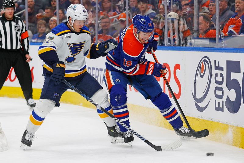 Feb 28, 2024; Edmonton, Alberta, CAN; Edmonton Oilers forward Zach Hyman (18) protects the puck from St. Louis Blues defensemen Torey Krug (47) during the first period at Rogers Place. Mandatory Credit: Perry Nelson-USA TODAY Sports