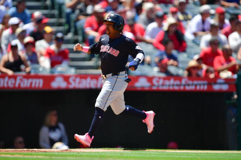 May 26, 2024; Anaheim, California, USA; Cleveland Guardians third base José Ramírez (11) scores a run against the Los Angeles Angels during the third inning at Angel Stadium. Mandatory Credit: Gary A. Vasquez-USA TODAY Sports