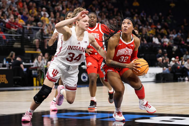 Mar 4, 2023; Minneapolis, MINN, USA; Ohio State Buckeyes forward Cotie McMahon (32) drives to the basket whole Indiana Hoosiers guard Grace Berger (34) defends during the first half at Target Center. Mandatory Credit: Matt Krohn-USA TODAY Sports