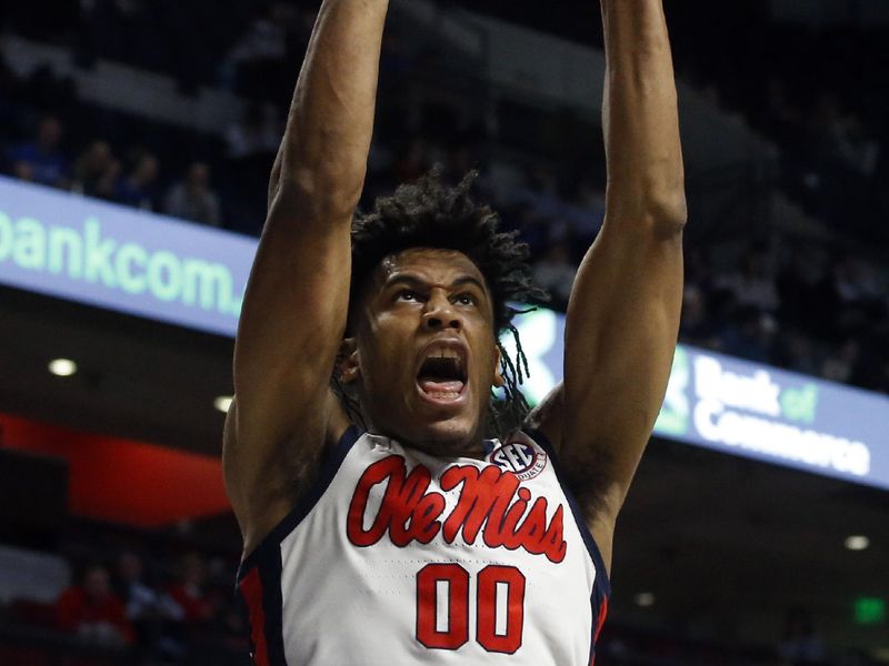 Jan 31, 2023; Oxford, Mississippi, USA; Mississippi Rebels forward Jayveous McKinnis (0) dunks during the second half against the Kentucky Wildcats at The Sandy and John Black Pavilion at Ole Miss. Mandatory Credit: Petre Thomas-USA TODAY Sports