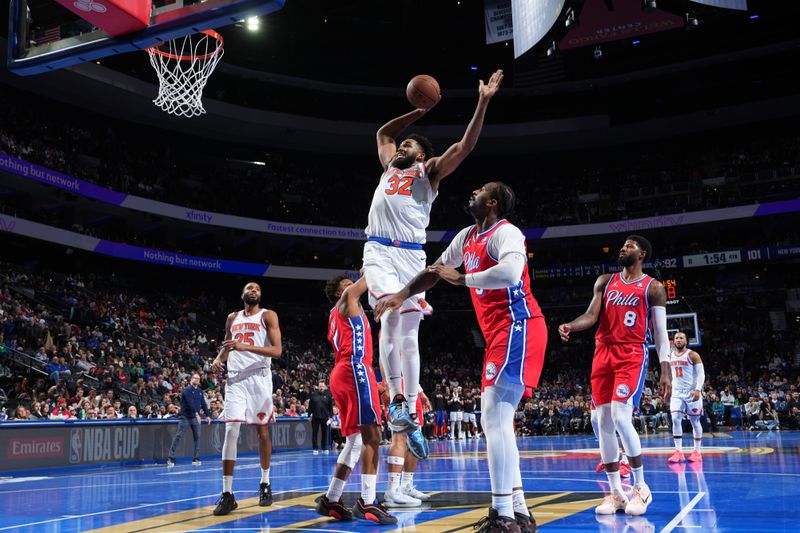 PHILADELPHIA, PA - NOVEMBER 12: Karl-Anthony Towns #32 of the New York Knicks drives to the basket during the game against the Philadelphia 76ers during the Emirates NBA Cup game on November 12, 2024 at the Wells Fargo Center in Philadelphia, Pennsylvania NOTE TO USER: User expressly acknowledges and agrees that, by downloading and/or using this Photograph, user is consenting to the terms and conditions of the Getty Images License Agreement. Mandatory Copyright Notice: Copyright 2024 NBAE (Photo by Jesse D. Garrabrant/NBAE via Getty Images)